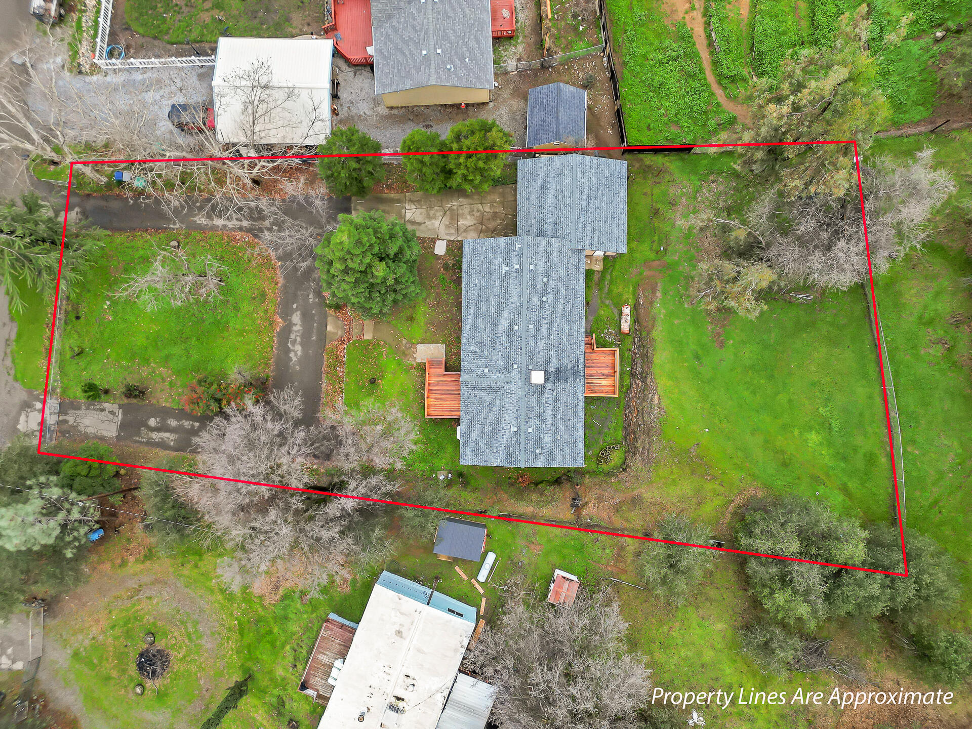 22150 Ravine Court Redding, CA 96003 - Photo 30 of 37 an aerial view of a house with a yard basket ball court and outdoor seating