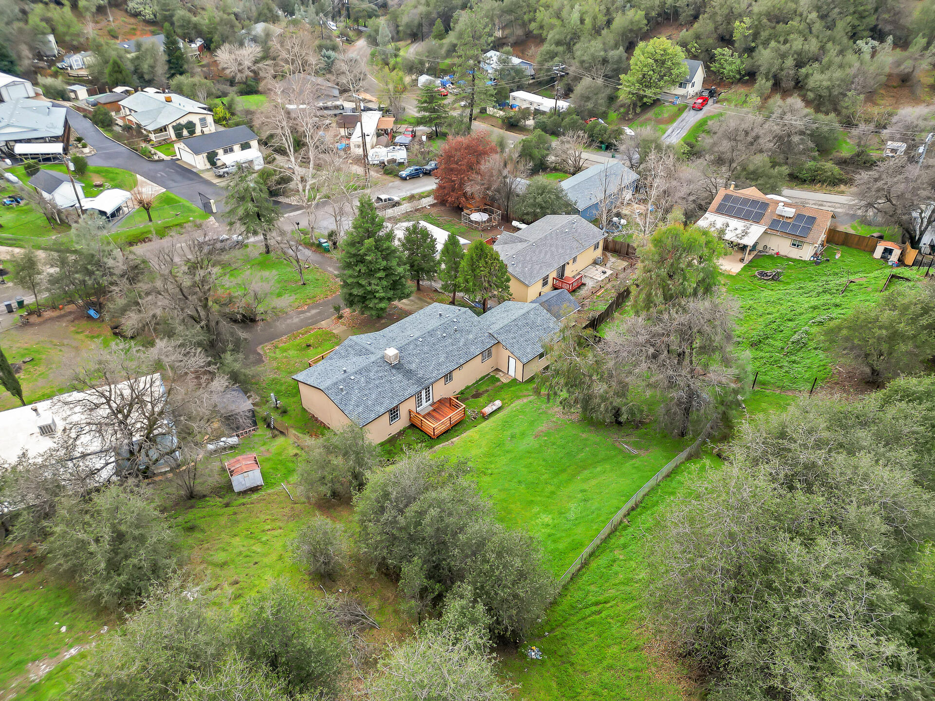 22150 Ravine Court Redding, CA 96003 - Photo 33 of 37 an aerial view of residential houses with outdoor space and trees all around