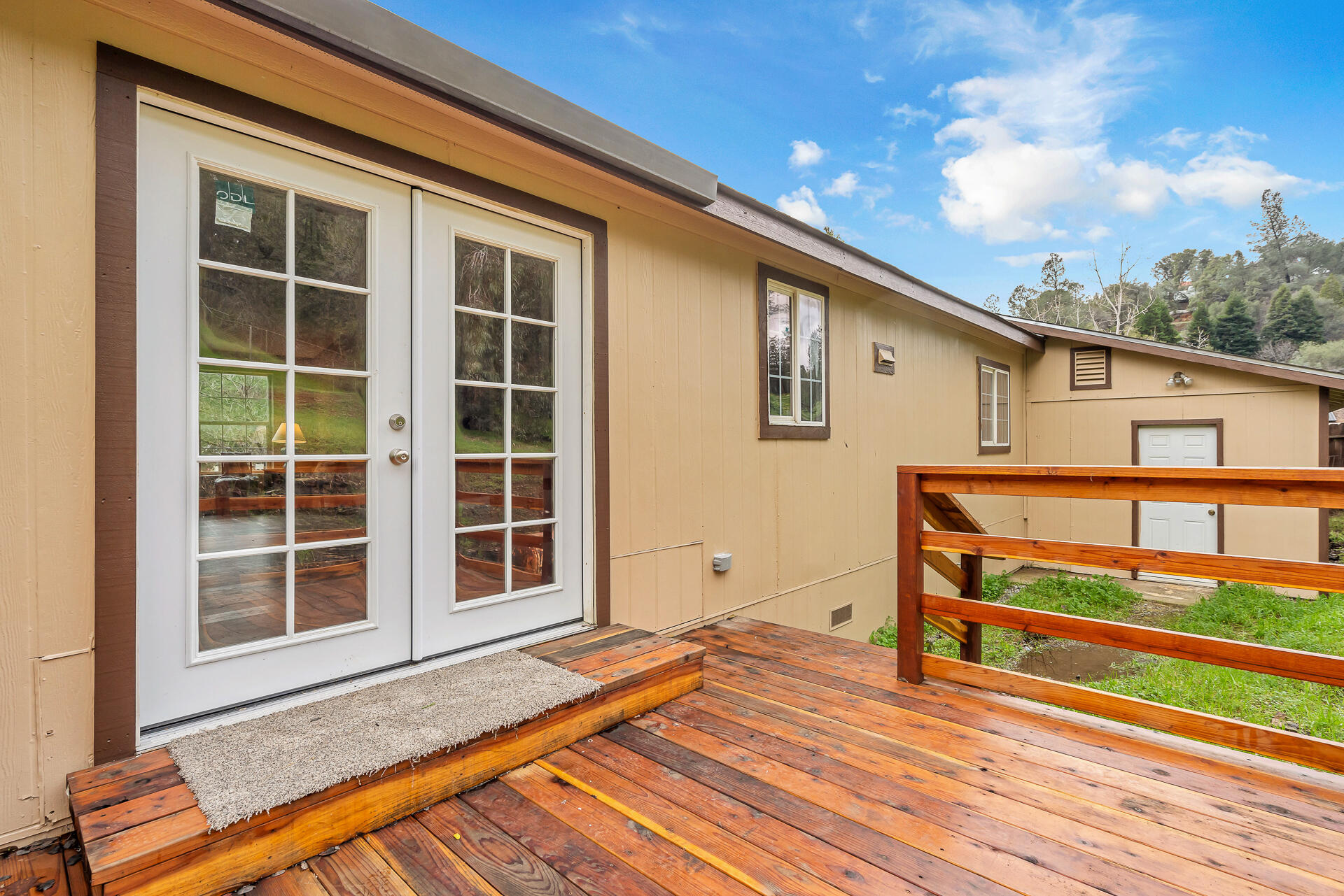 22150 Ravine Court Redding, CA 96003 - Photo 36 of 37 a view of house with deck and wooden floor