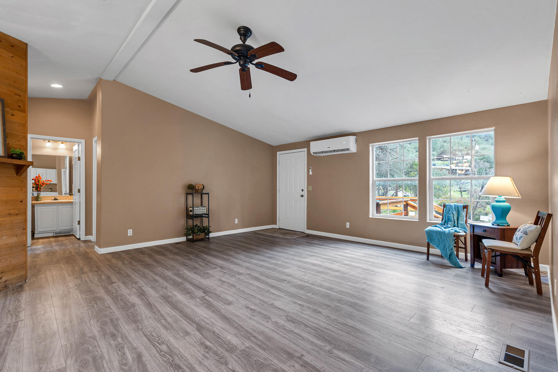 22150 Ravine Court Redding, CA 96003 - Photo 7 of 37 a view of a livingroom with a window and wooden floor