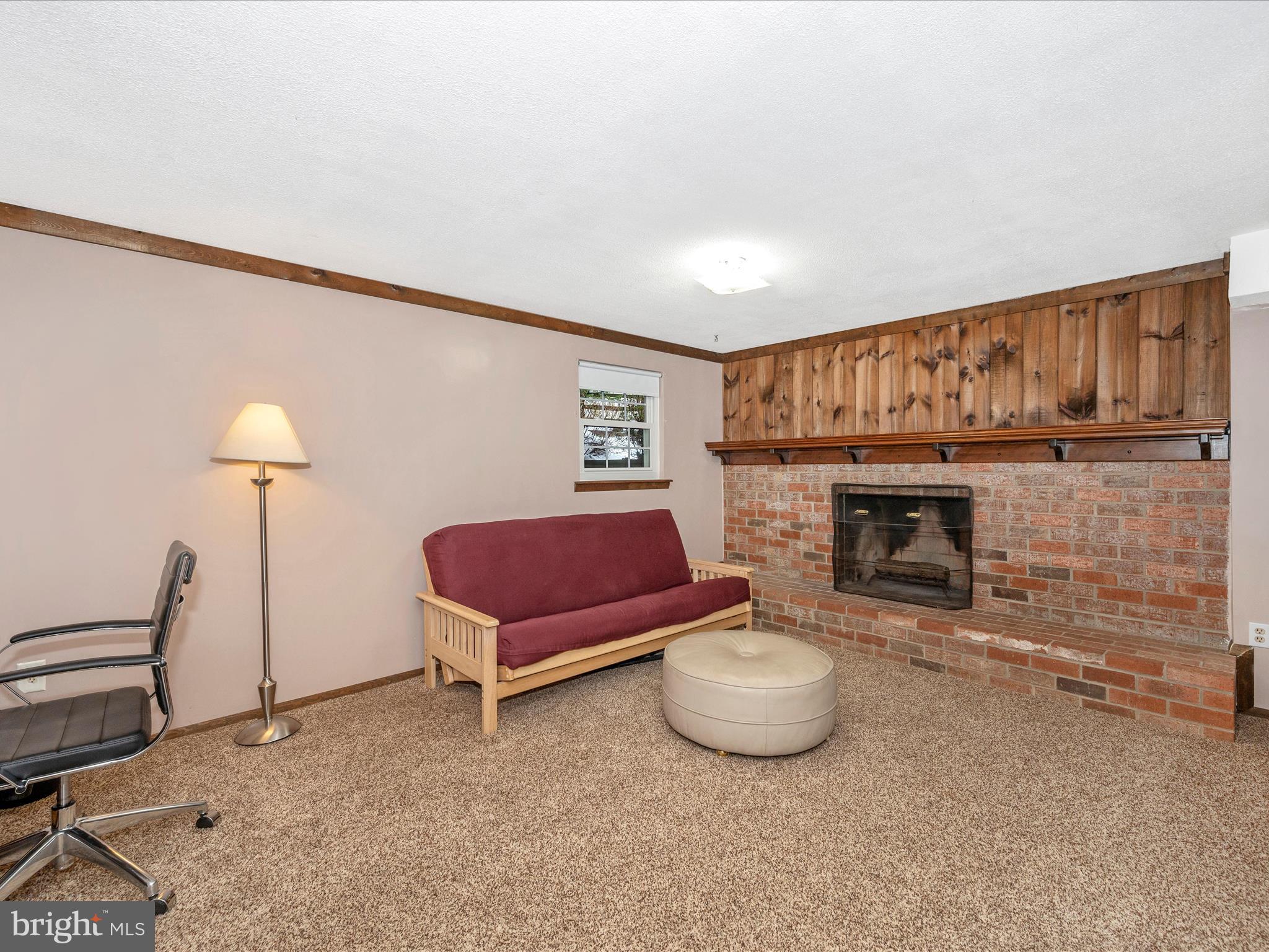 24000 Bush Hill Road Gaithersburg, MD 20882 - Photo 34 of 55 Lower Level with woodburning brick fireplace