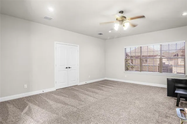 a bathroom with a bathtub shower sink vanity mirror and toilet