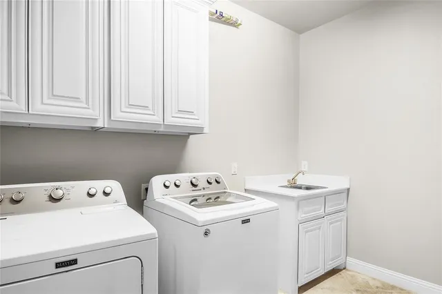 a view of a patio with a table and chairs and potted plants