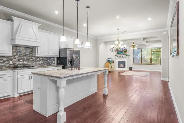 a living room with furniture a fireplace and a window