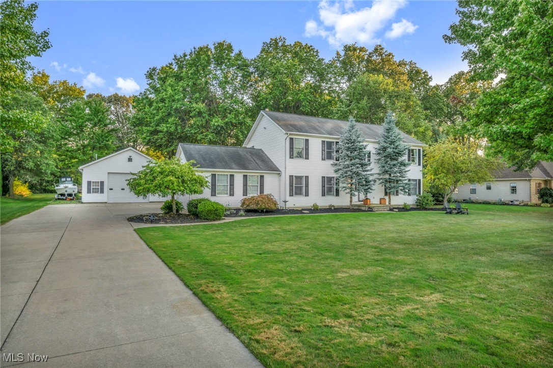 14902 Kneisel Road Vermilion, OH 44089 - Photo 2 of 49 Colonial house with a garage and a front lawn