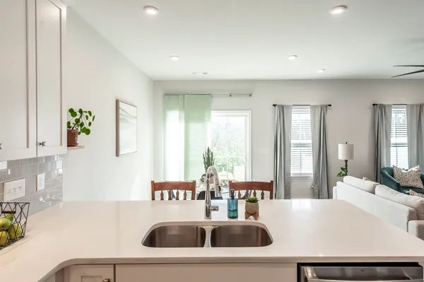 a view of kitchen island with stainless steel appliances