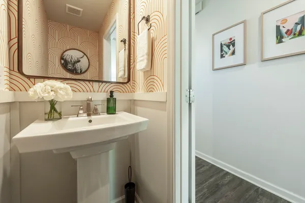 a bathroom with a sink and a mirror