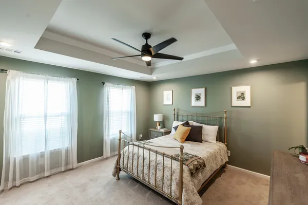 a bedroom with a bed and window
