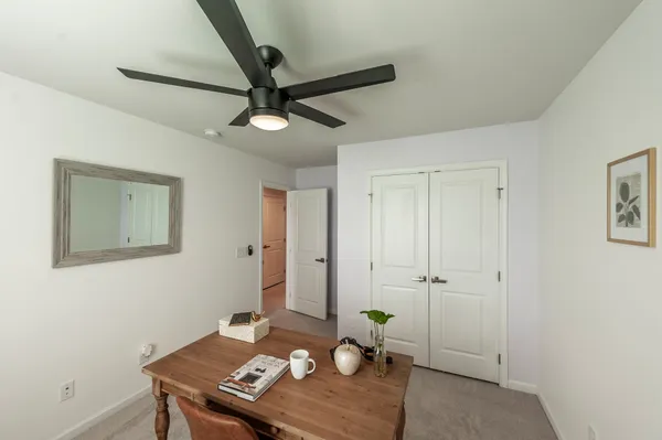 a view of a workspace with furniture