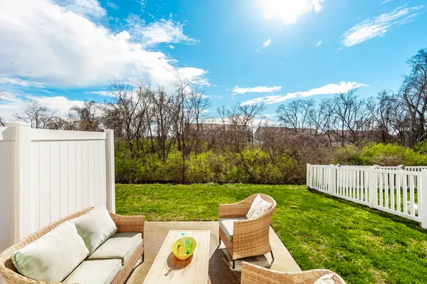 a view of an chairs and tables in the backyard