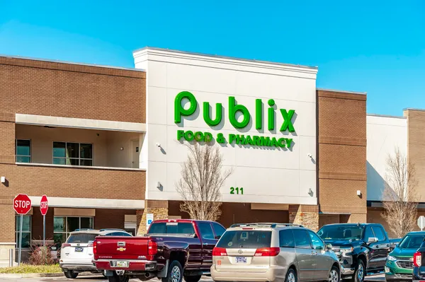 a front view of a building with a sign board