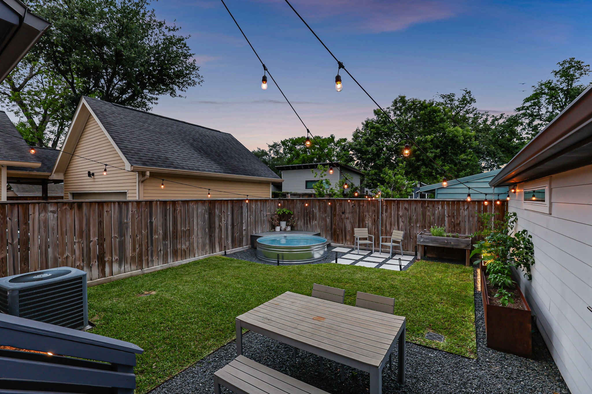 914 Robbie Street Houston, TX 77009 - Photo 6 of 50 a view of a backyard with plants and a patio