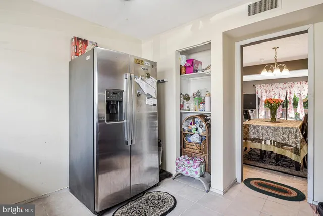 a refrigerator freezer and a wooden floor