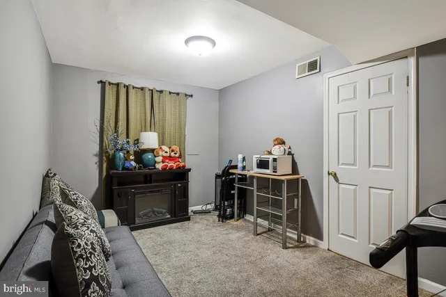 a bed room with furniture and a window