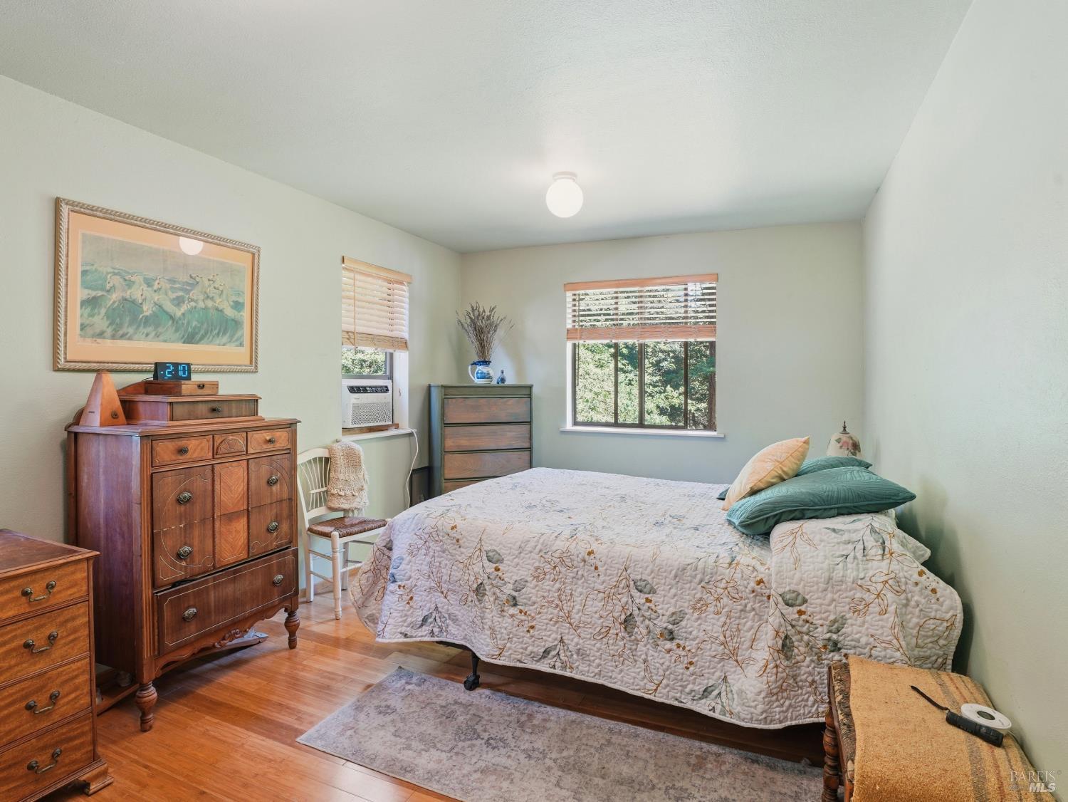 31397 Seaview Road Cazadero, CA 95421 - Photo 18 of 47 a bedroom with a bed and wooden floor