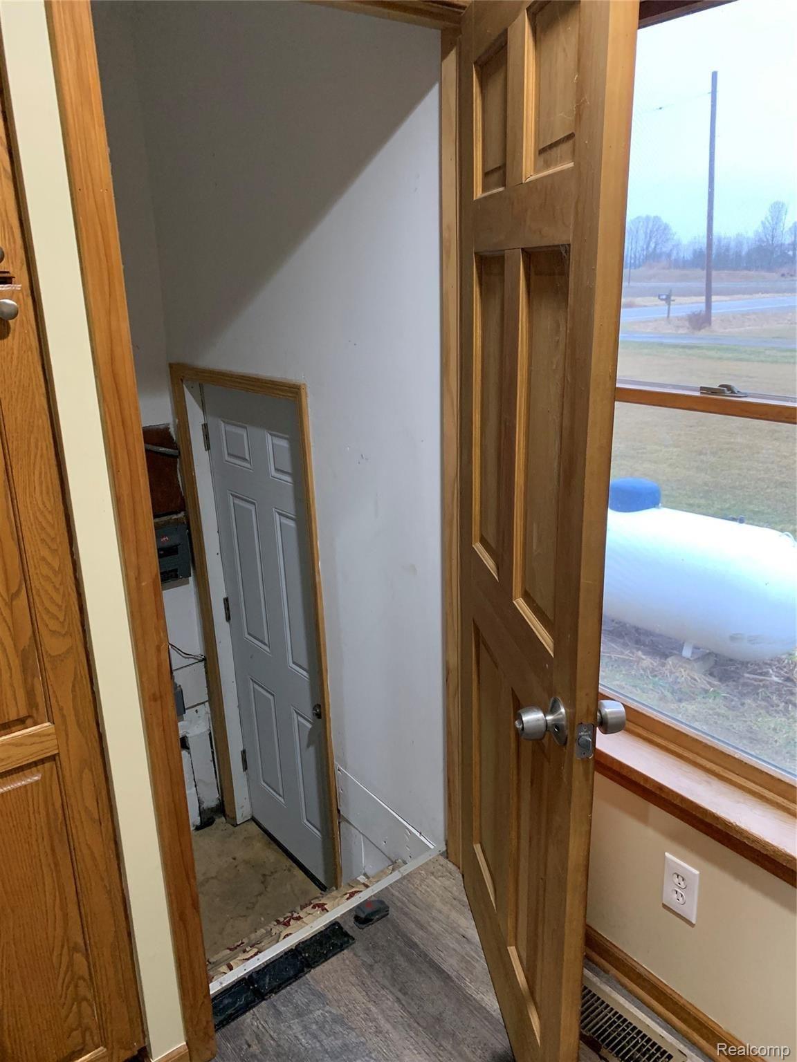 7078 Fargo Road Avoca, MI 48006 - Photo 36 of 41 door to basement and door to left side of house