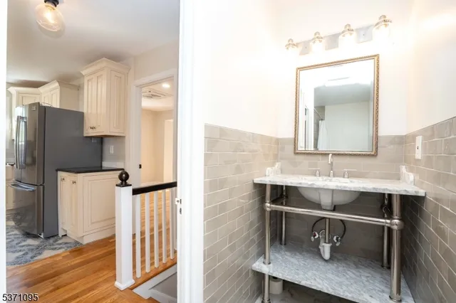a bathroom with a sink a mirror and a toilet