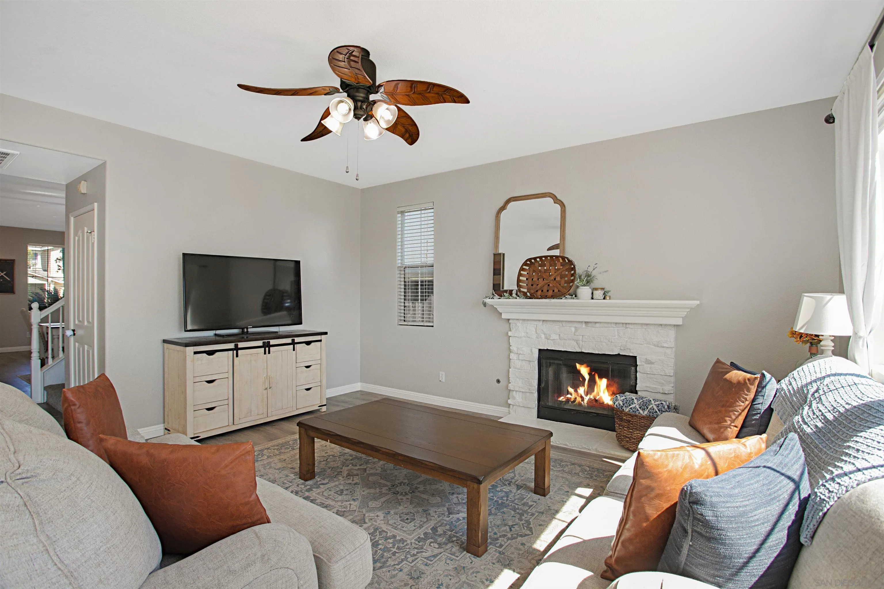 1091 Greenway Road Oceanside, CA 92057 - Photo 11 of 26 a living room with furniture and a fireplace