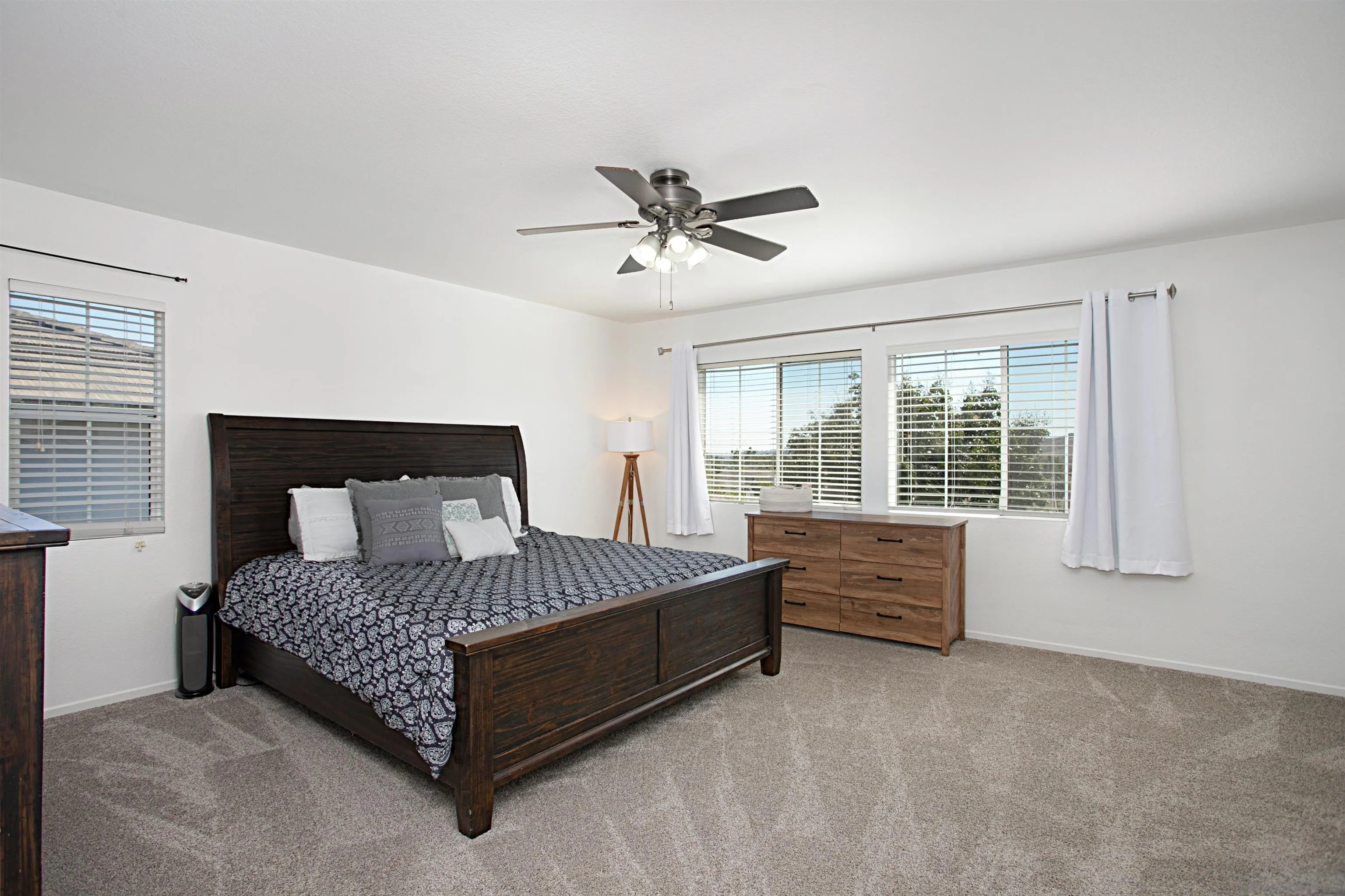 1091 Greenway Road Oceanside, CA 92057 - Photo 14 of 26 a bed sitting in a bedroom next to a window