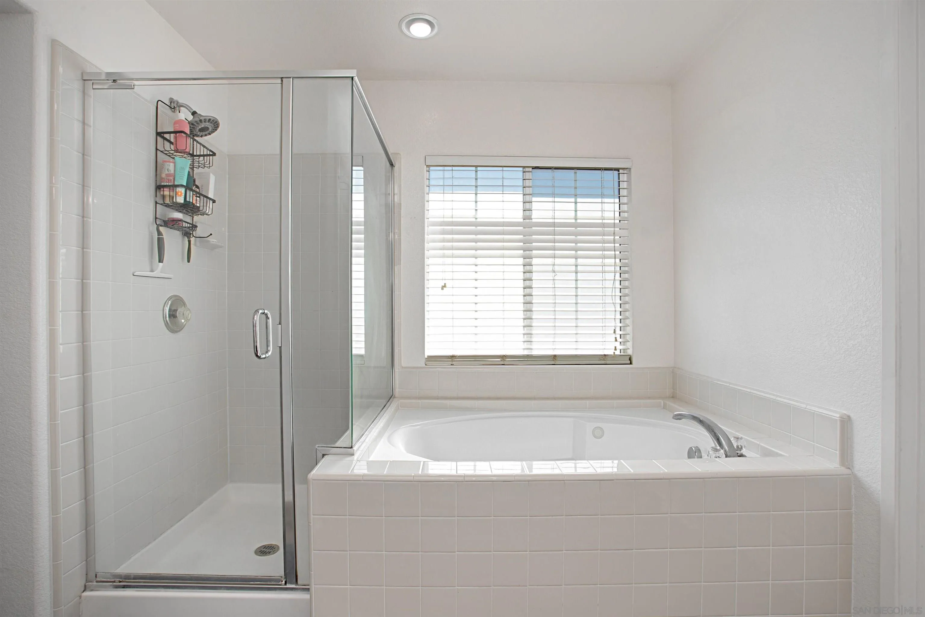 1091 Greenway Road Oceanside, CA 92057 - Photo 17 of 26 a bathroom with a bathtub and shower