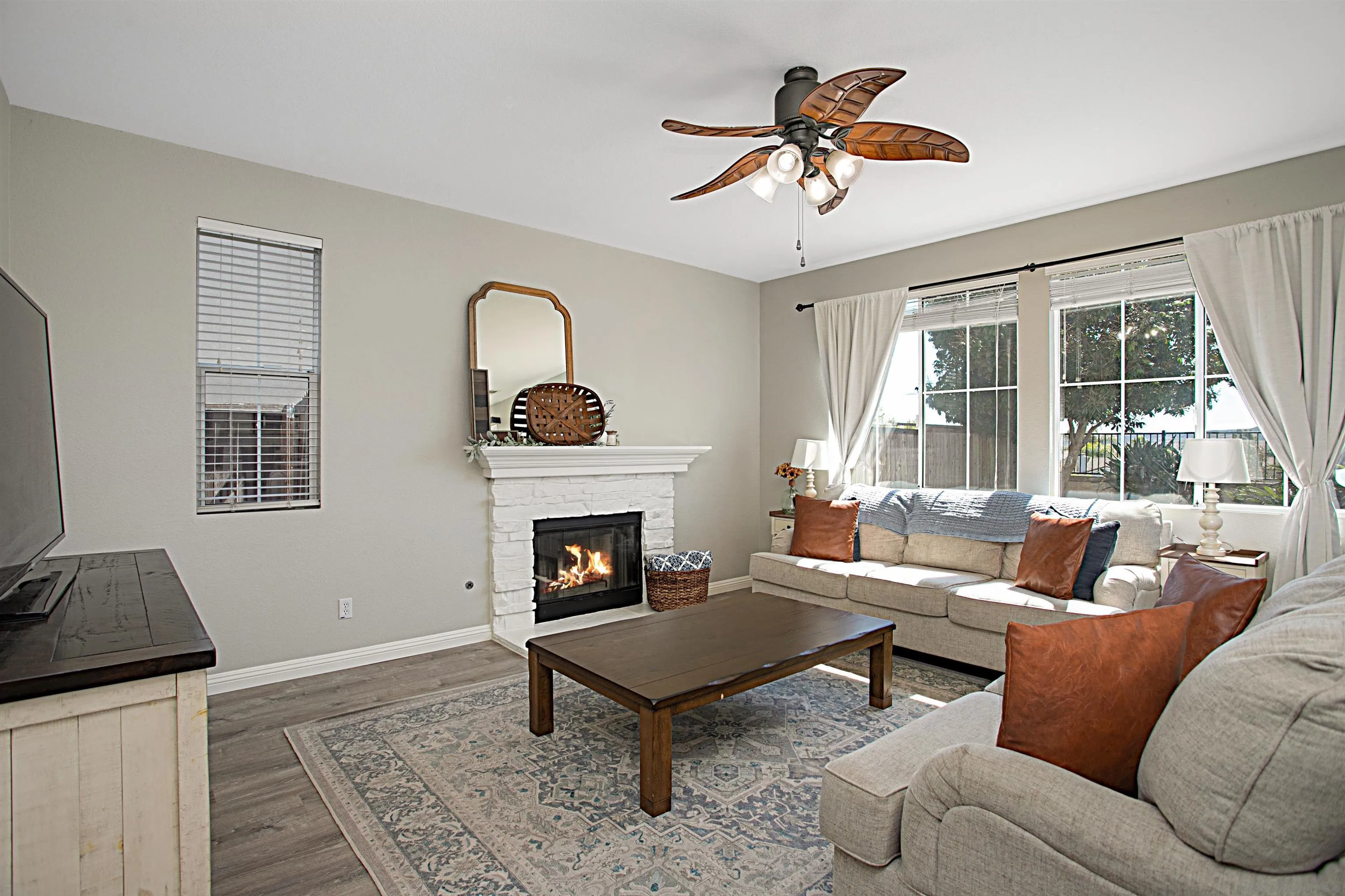 1091 Greenway Road Oceanside, CA 92057 - Photo 4 of 26 a living room with furniture and a fireplace