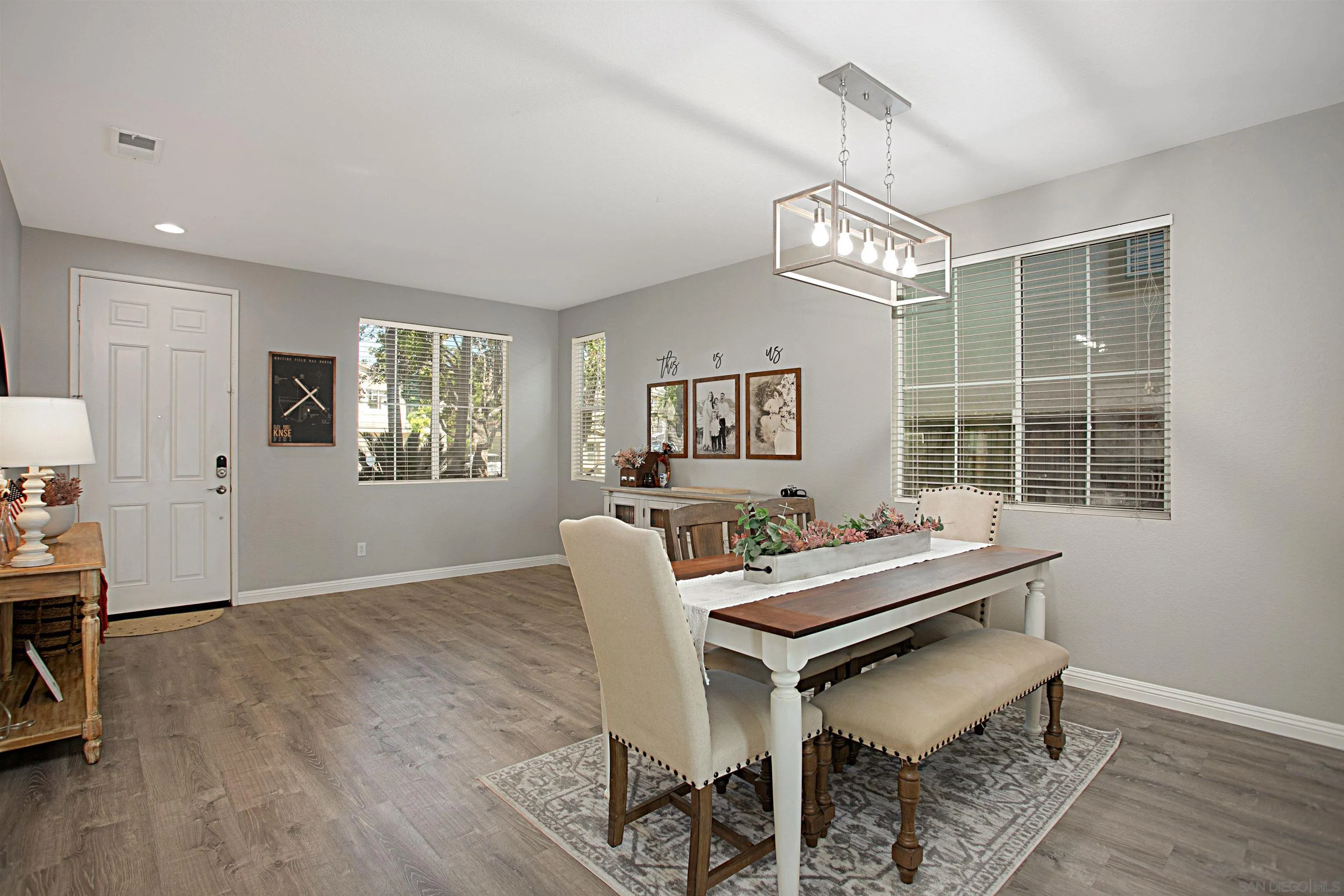 1091 Greenway Road Oceanside, CA 92057 - Photo 7 of 26 a living room with furniture a window and wooden floor