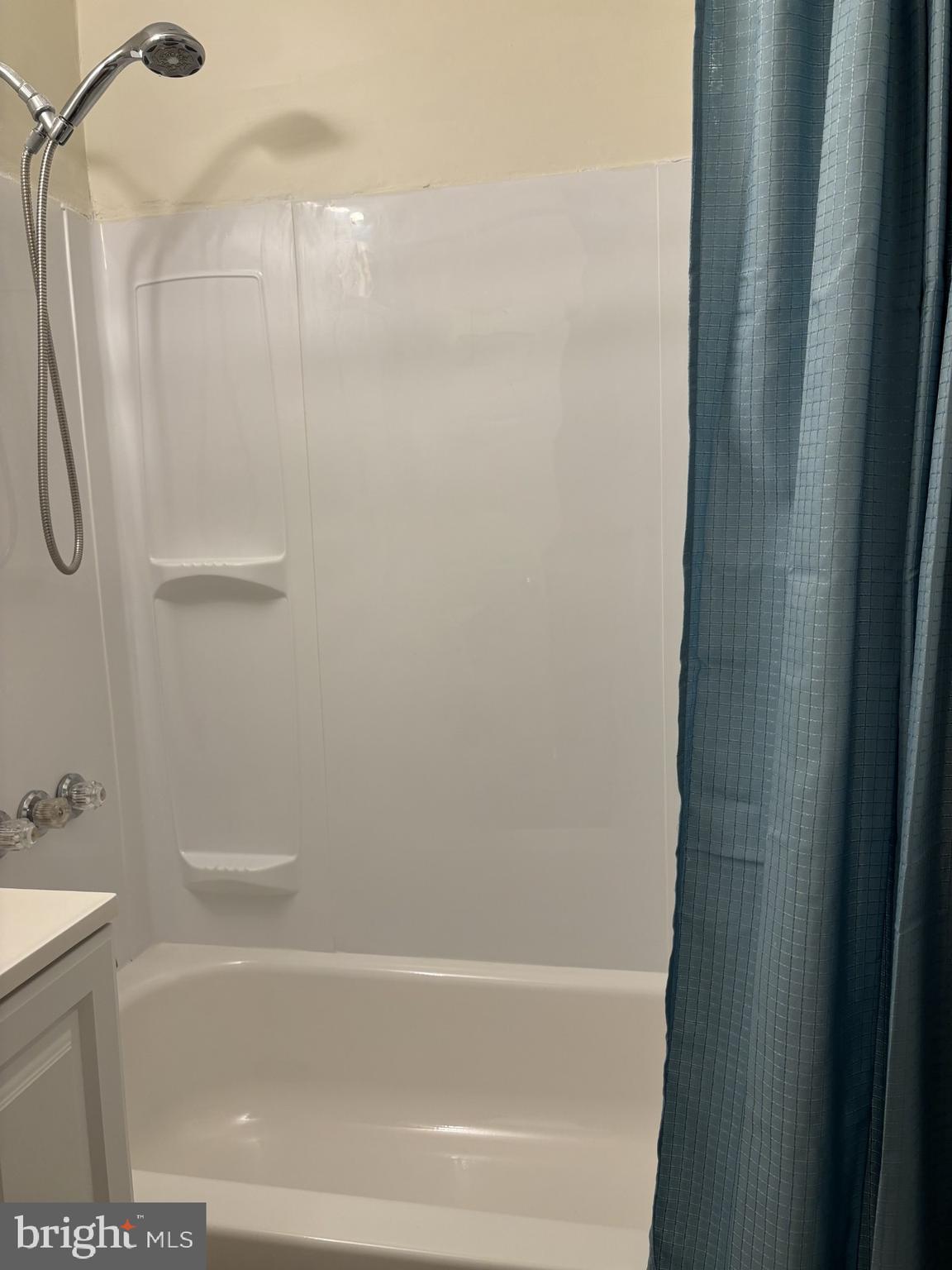 4907 Rawle Street Philadelphia, PA 19135 - Photo 15 of 24 a bathroom with a bathtub and a shower