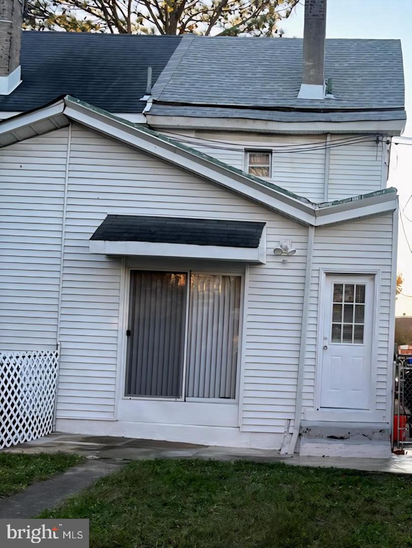 4907 Rawle Street Philadelphia, PA 19135 - Photo 5 of 24 a front view of a house with a garden