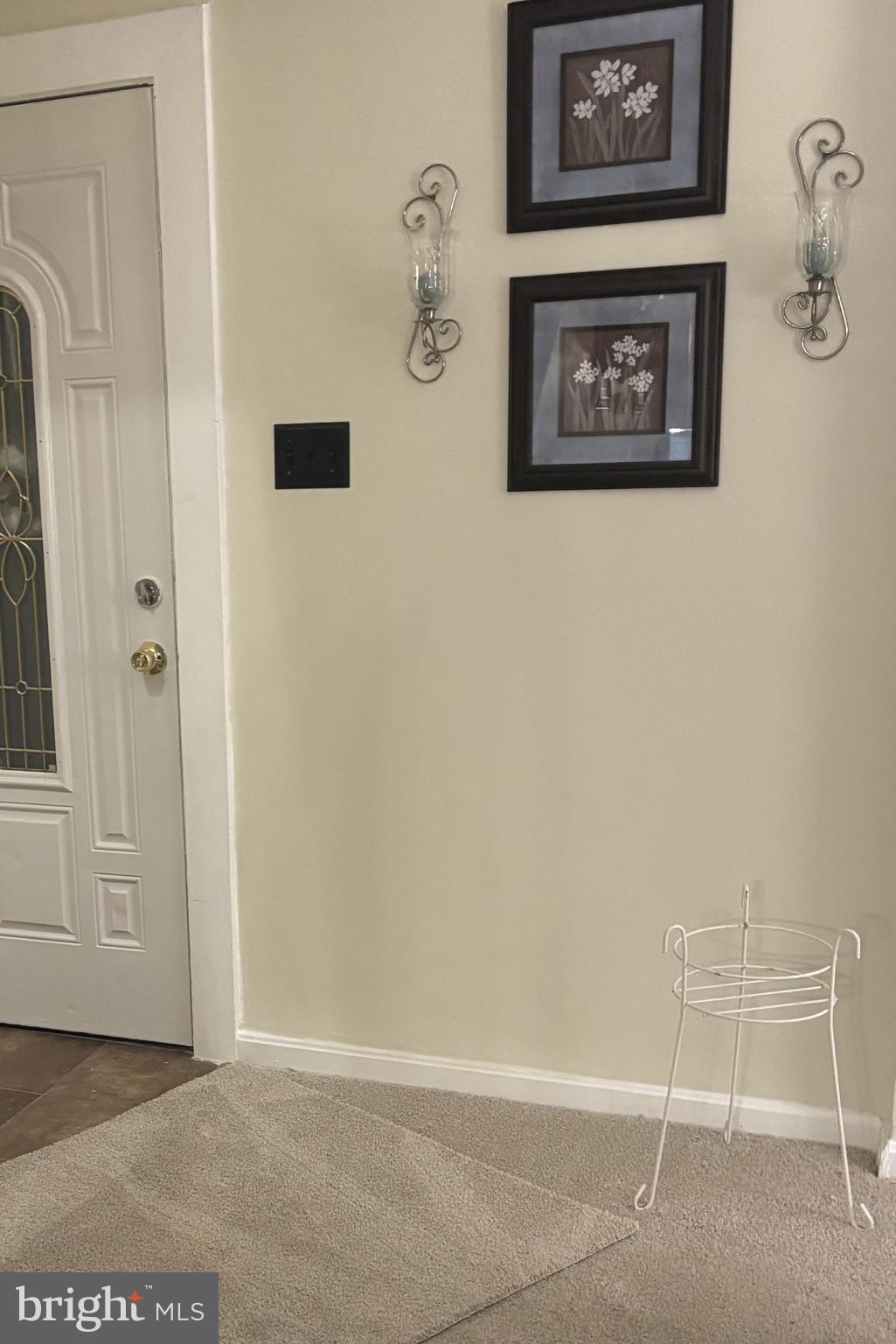 4907 Rawle Street Philadelphia, PA 19135 - Photo 8 of 24 a view of a hallway with paintings on the wall
