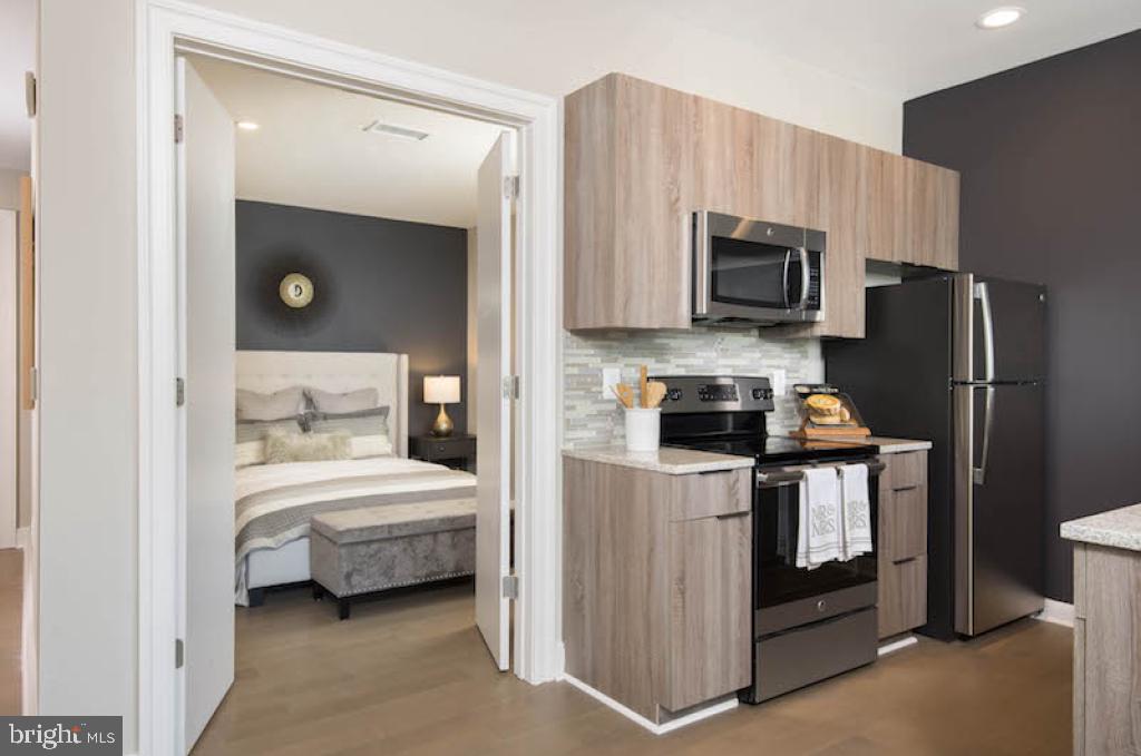 200 North 16th Street, Unit 1624 Philadelphia, PA 19102 - Photo 43 of 66 a kitchen with a sink a stove and refrigerator