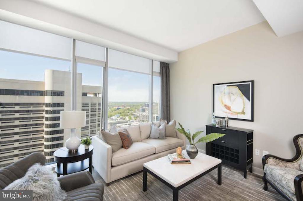 200 North 16th Street, Unit 1624 Philadelphia, PA 19102 - Photo 55 of 66 a living room with furniture and a potted plant