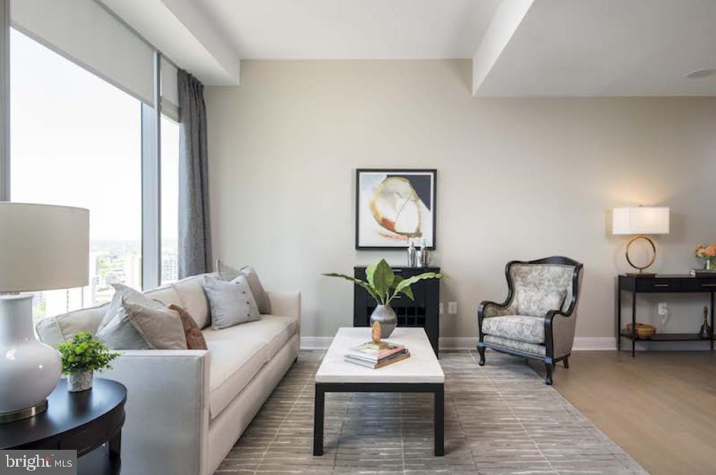 200 North 16th Street, Unit 1624 Philadelphia, PA 19102 - Photo 56 of 66 a living room with furniture and a potted plant