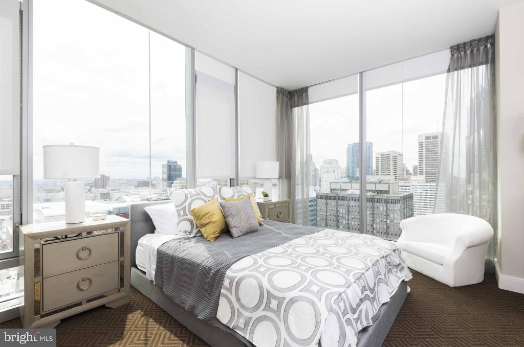 200 North 16th Street, Unit 1624 Philadelphia, PA 19102 - Photo 60 of 66 a bedroom with a bed and large windows