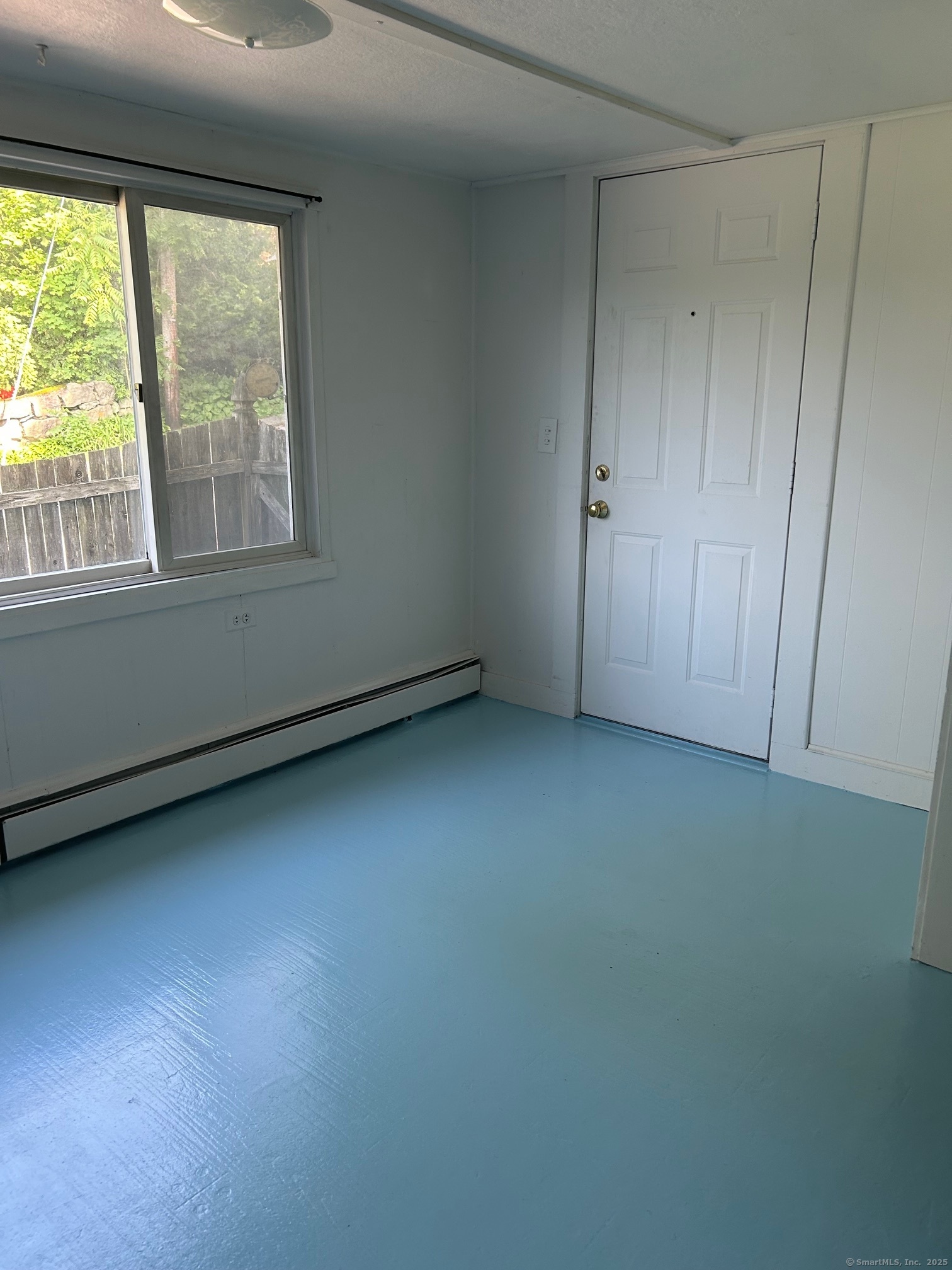 123 Bridge Street Groton, CT 06340 - Photo 13 of 13 an empty room with a window