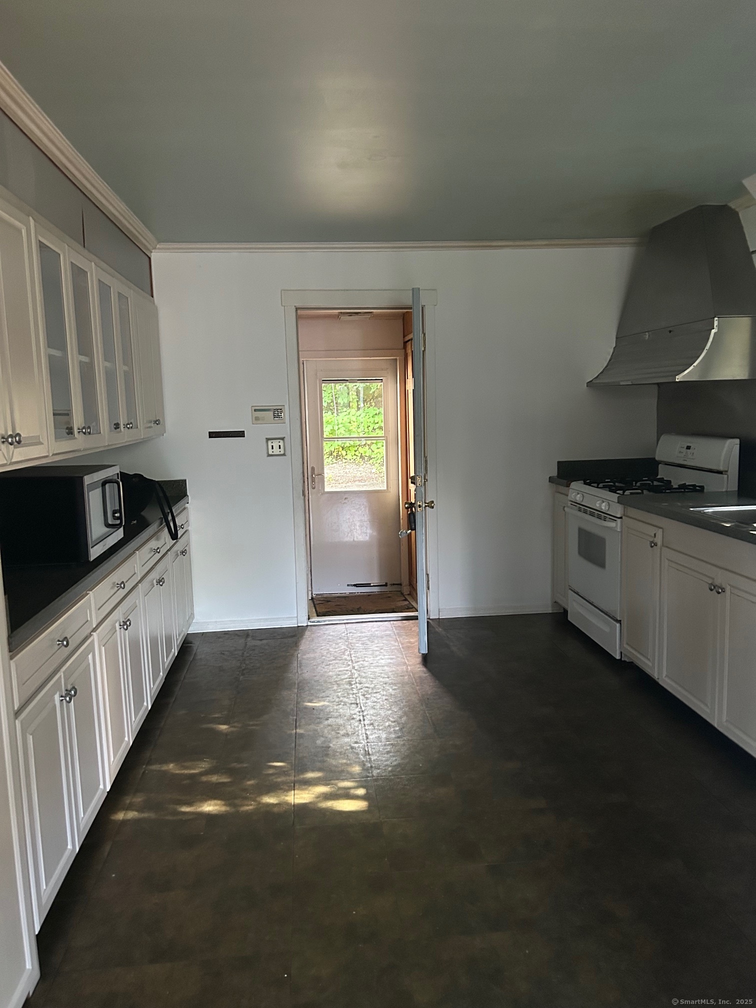 123 Bridge Street Groton, CT 06340 - Photo 3 of 13 a kitchen with granite countertop a stove and a sink