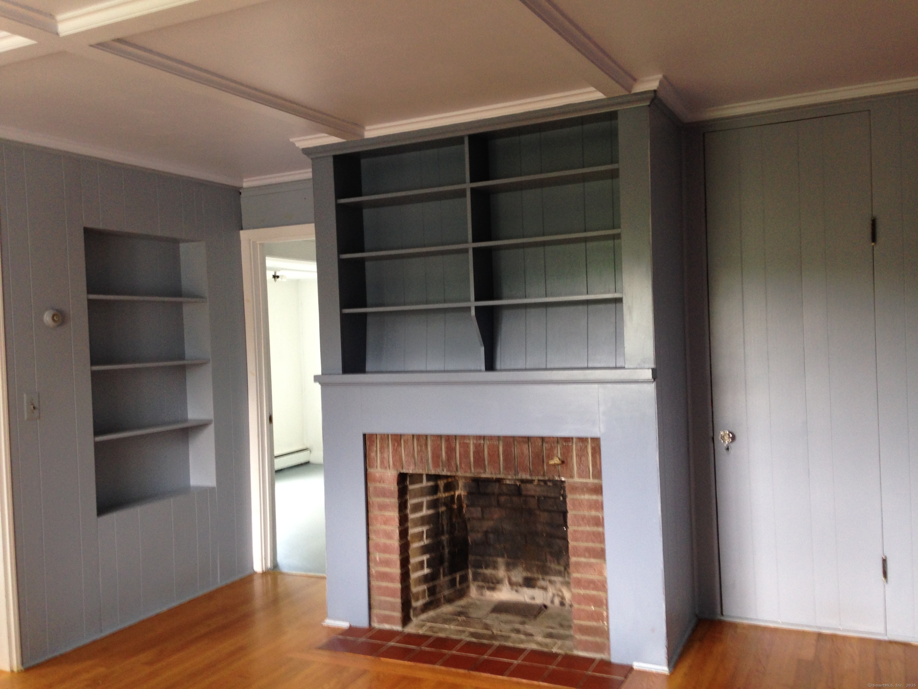 123 Bridge Street Groton, CT 06340 - Photo 5 of 13 a living room with a fireplace