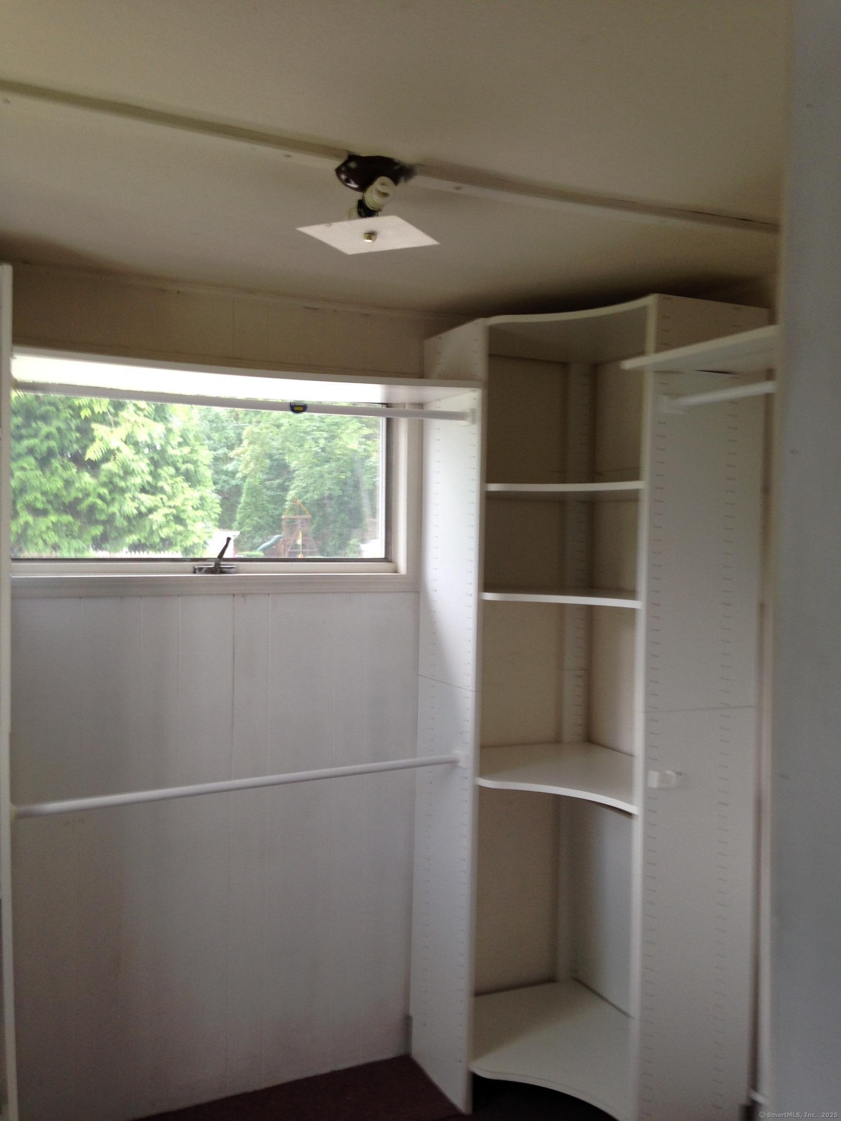 123 Bridge Street Groton, CT 06340 - Photo 7 of 13 a view of storage and utility room with a window