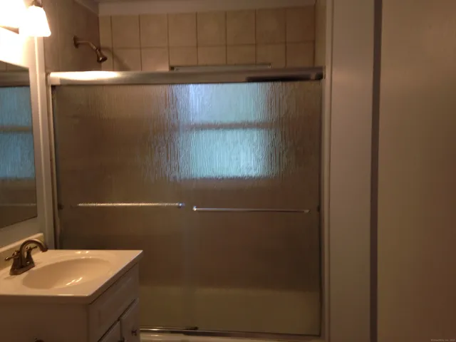 a bathroom with a sink and mirror