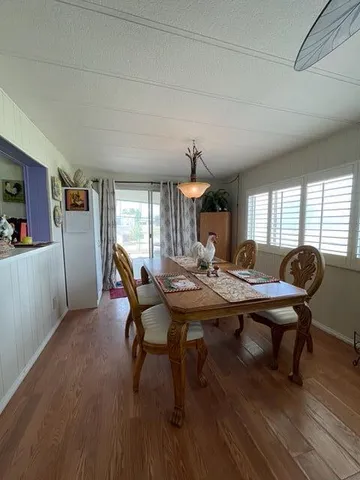 a view of a workspace with furniture and window