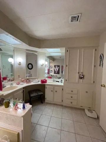 a kitchen with a sink and cabinets