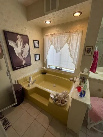 a room with furniture and wall paintings