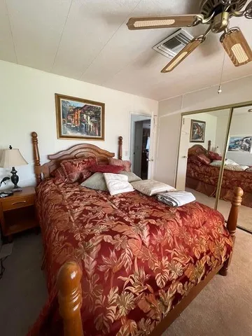 a bedroom with bed and window