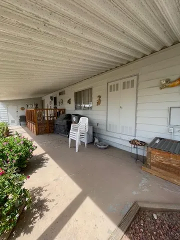 a view of a livingroom with furniture and window
