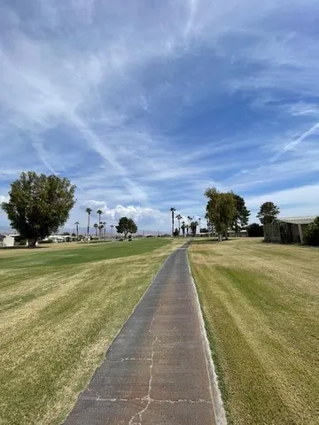 a view of a swimming pool and an outdoor seating