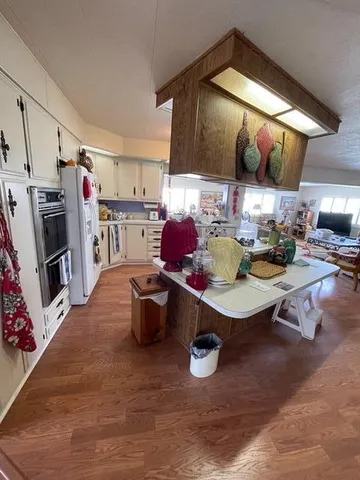 a kitchen with a sink cabinets and appliances