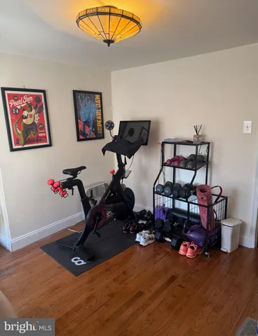 a bathroom with a sink a toilet a mirror and shower