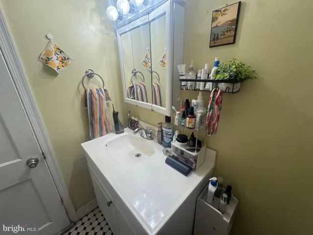 a bathroom with a toilet a sink and shower