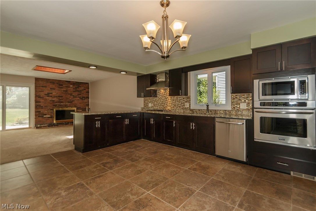 5590 Ridgebury Boulevard Lyndhurst, OH 44124 - Photo 3 of 25 Talk about room to entertain your guests while preparing a feast.