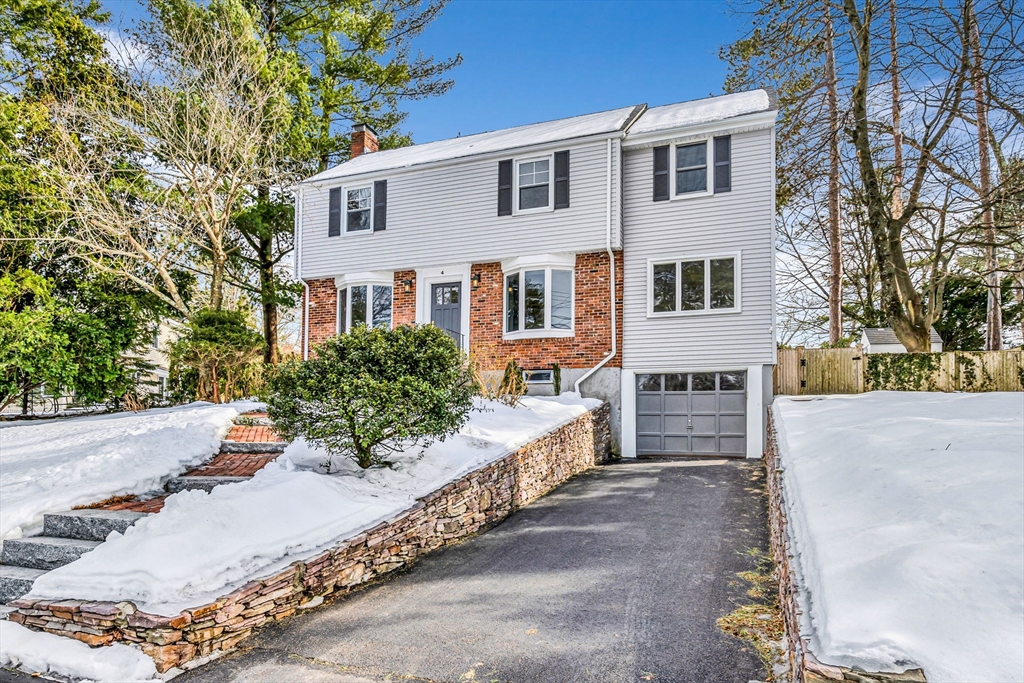 4 Retrop Road Natick, MA 01760 - Photo 1 of 26 a house that has a tree in front of it