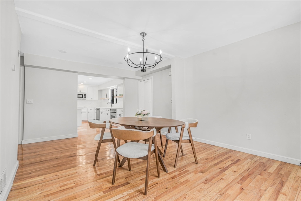 4 Retrop Road Natick, MA 01760 - Photo 12 of 26 a view of a dining room with furniture window and wooden floor